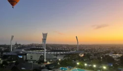 Hot air balloon flying over football stadium in Geelong