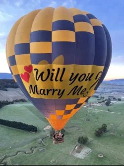 Will you marry me banner on hot air balloon exlusive flight